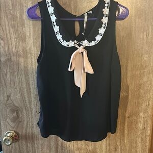 Black Sleeveless Top with Floral Trim